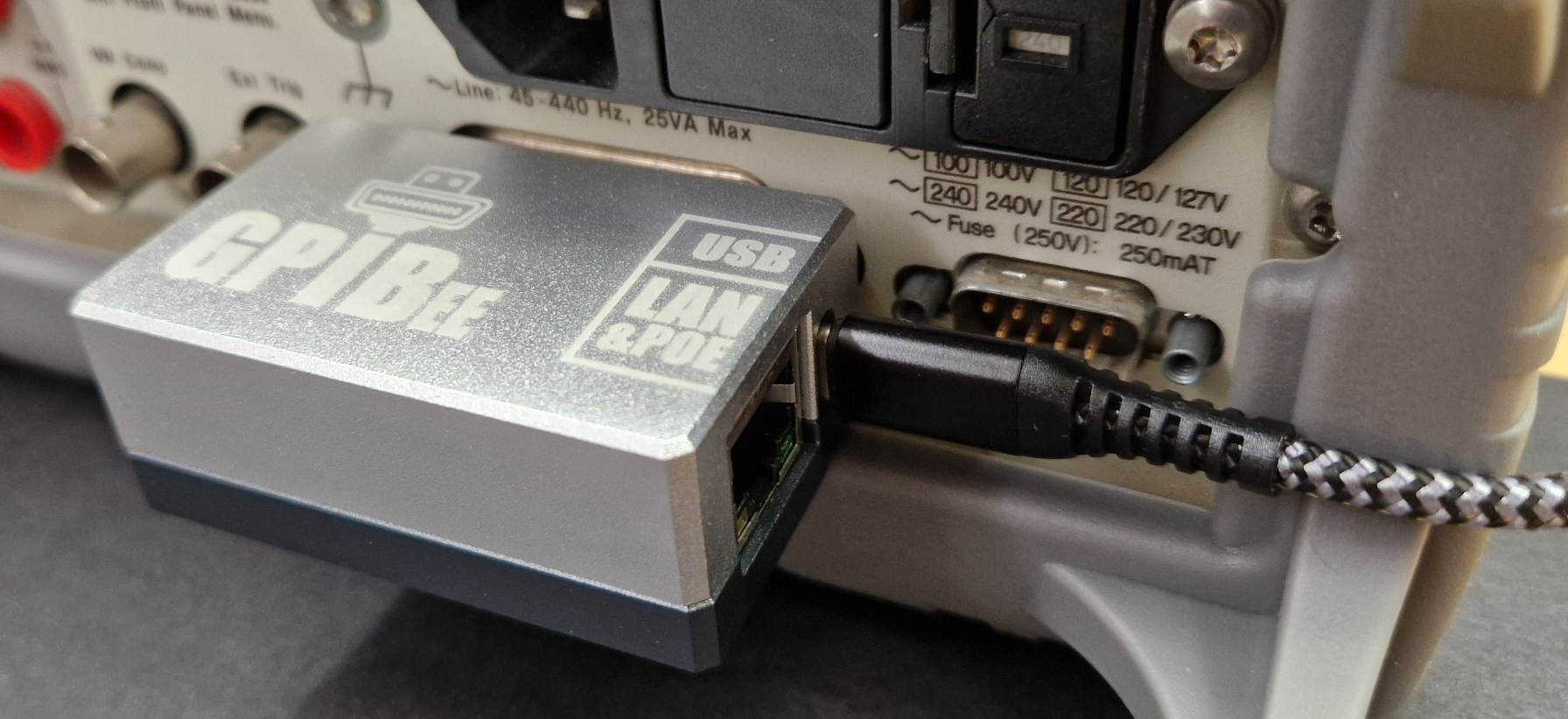 GPIBee plugged directly into an instrument's GPIB port, with a USB-C cable connected